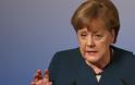 Μέρκελ: Η Γερμανία πρέπει να βοηθήσει τον νέο πρόεδρο της Γαλλίας να επιτύχει