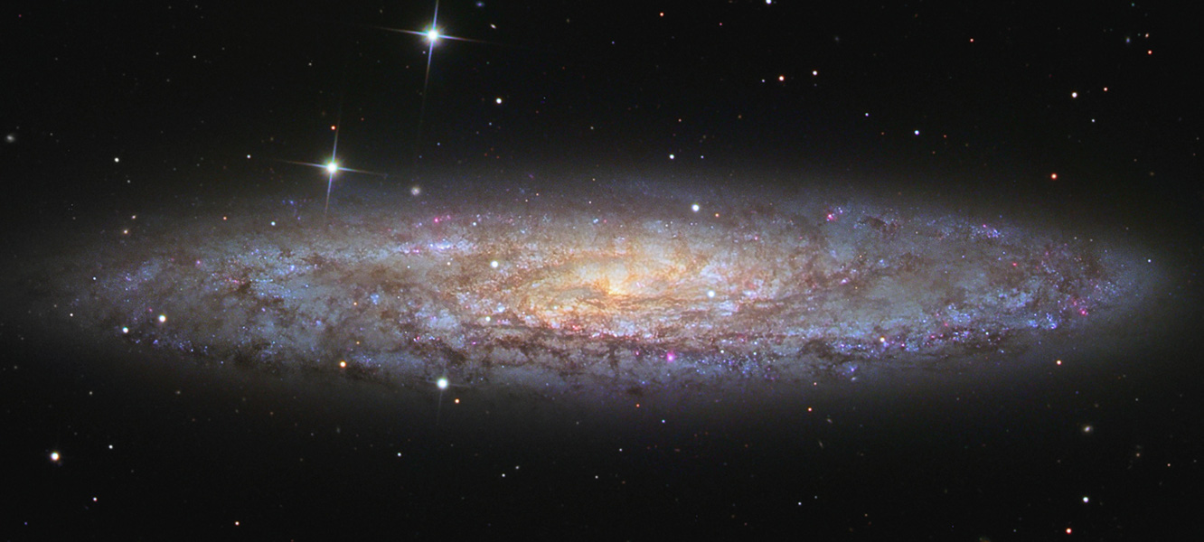 NGC 253: Ένα λαμπερά σκονισμένο Αστέρι του Διαστήματος - Φωτογραφία 1