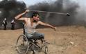Η εμβληματική φωτογραφία που έγινε σύμβολο αντίστασης του παλαιστινιακού λαού - Φωτογραφία 1