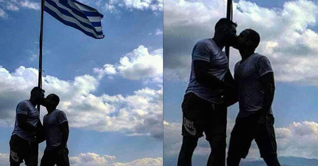 Αξιωματικός της ελληνικής αστυνομίας φιλιέται με «μετανάστη» μπροστά στην Ελληνική σημαία - Φωτογραφία 1