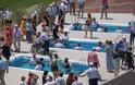 Εκατοντάδες άτομα βαφτίστηκαν ως Μάρτυρες του Ιεχωβά στο Ο.Α.Κ.Α (Photo)