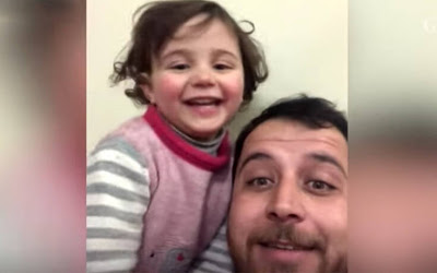 Ένας υπέροχος πατέρας: Έμαθε την κορούλα του να γελά κάθε φορά που ακούει βόμβες στη Συρία (video) - Φωτογραφία 2