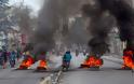 Αϊτή: Παρέλυσε χθες η πρωτεύουσα μετά τα αιματηρά επεισόδια μεταξύ αστυνομικών και στρατιωτικών - Φωτογραφία 1