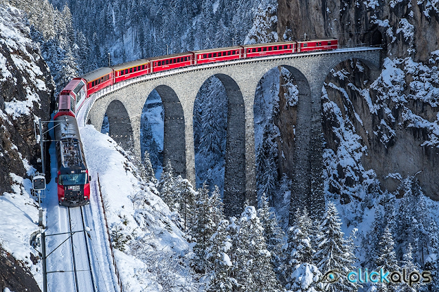 Παραμυθένια σιδηροδρομική διαδρομή στις χιονισμένες Άλπεις – Το κόκκινο τρένο που διασχίζει 55 τούνελ και 196 γέφυρες - Φωτογραφία 1