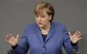Μέρκελ: «Απόλυτη πολιτική βούληση» για σταθερό ευρώ