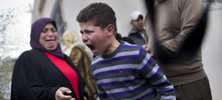 H φωτογραφία του παλαιστίνιου πιτσιρικά που σόκαρε τον πλανήτη - Φωτογραφία 1