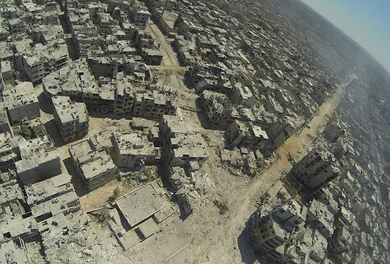 Αεροφωτογραφίες δείχνουν την πλήρη καταστροφή της Συριακής πόλης Χομς - Φωτογραφία 1