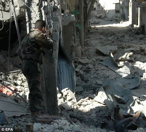Αεροφωτογραφίες δείχνουν την πλήρη καταστροφή της Συριακής πόλης Χομς - Φωτογραφία 13