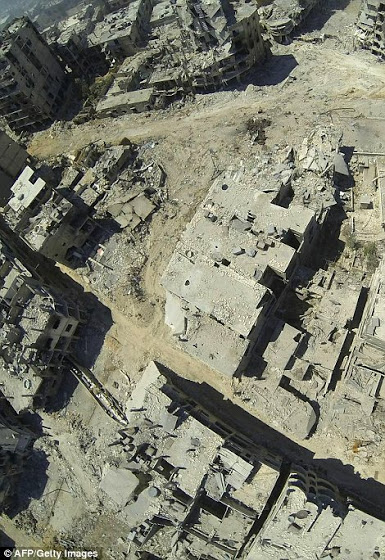 Αεροφωτογραφίες δείχνουν την πλήρη καταστροφή της Συριακής πόλης Χομς - Φωτογραφία 2