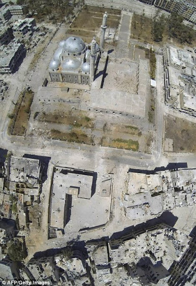 Αεροφωτογραφίες δείχνουν την πλήρη καταστροφή της Συριακής πόλης Χομς - Φωτογραφία 3