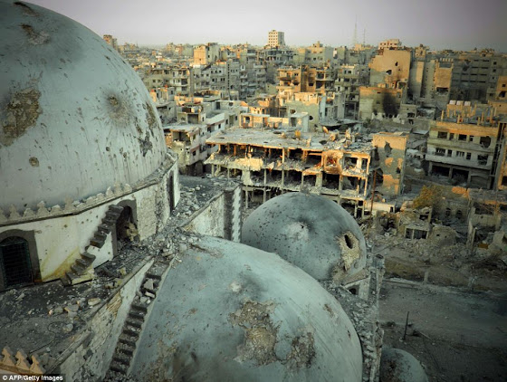 Αεροφωτογραφίες δείχνουν την πλήρη καταστροφή της Συριακής πόλης Χομς - Φωτογραφία 5