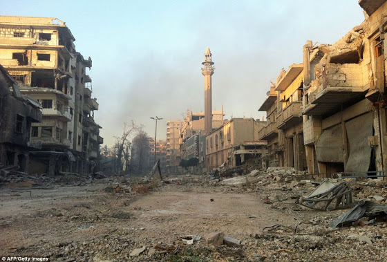 Αεροφωτογραφίες δείχνουν την πλήρη καταστροφή της Συριακής πόλης Χομς - Φωτογραφία 8