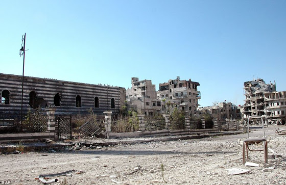 Αεροφωτογραφίες δείχνουν την πλήρη καταστροφή της Συριακής πόλης Χομς - Φωτογραφία 9