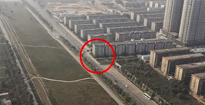 Κίνα: Έκτισαν κατά λάθος πολυκατοικία στη μέση ενός αυτοκινητόδρομου! (φωτό) - Φωτογραφία 1