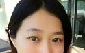 Το πρόσωπο μιας κοπέλας από την Ασία πίσω από το μακιγιάζ