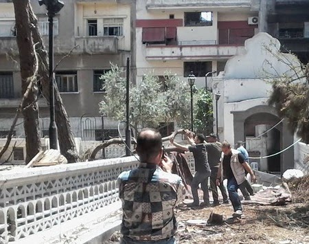 Δείτε σε τι κατάσταση βρίσκεται πλέον η πόλη του Χομς - Φωτορεπορτάζ με εικόνες που συγκλονίζουν - Φωτογραφία 1
