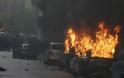 Σφοδρές συγκρούσεις αστυνομίας-διαδηλωτών στο Μιλάνο: Πυρπόλησαν αυτοκίνητα, τράπεζες και μαγαζιά - Φωτογραφία 4