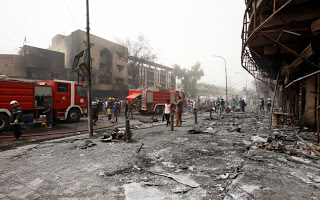 Στους 35 οι νεκροί από την τριπλή επίθεση βομβιστών αυτοκτονίας στη Βαγδάτη - Φωτογραφία 1